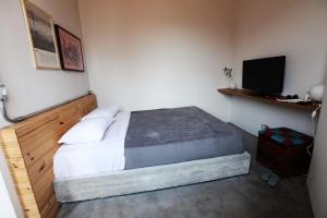 Uma cama ou camas num quarto em Casa SP011