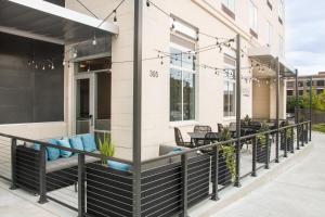 a balcony with chairs and tables on a building at Fairfield Inn & Suites by Marriott Dayton in Dayton