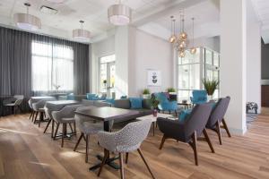 a dining room with blue chairs and tables at Fairfield Inn & Suites by Marriott Dayton in Dayton