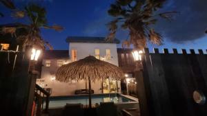 a resort with a swimming pool at night at Gyeongju Sweetcreamhill Pension in Gyeongju