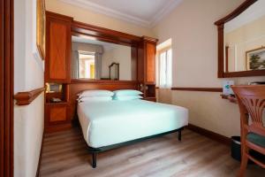 Postel nebo postele na pokoji v ubytování Hotel Hiberia