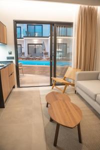 a living room with a couch and a table at Saladar Suites Boutique in Morro del Jable