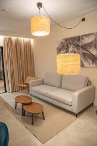 a living room with a couch and a table at Saladar Suites Boutique in Morro del Jable