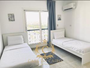 Łóżko lub łóżka w pokoju w obiekcie Casa Do Cairo-AlRehab
