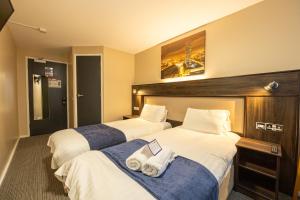 Postel nebo postele na pokoji v ubytování Stay Inn Manchester