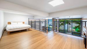 En eller flere senge i et værelse på Gapyeong Sungshine Pension