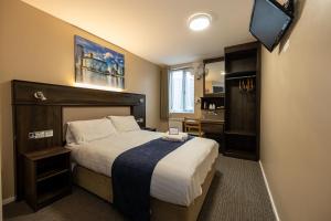 Postel nebo postele na pokoji v ubytování Stay Inn Manchester