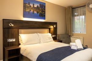Postel nebo postele na pokoji v ubytování Stay Inn Manchester