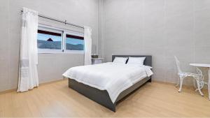 Postel nebo postele na pokoji v ubytování Gapyeong Ddel Poolvilla + 9 fotografií