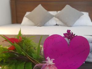Letto o letti in una camera di TaMaRiNd house