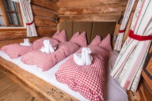 Postel nebo postele na pokoji v ubytování Kulinarik zur Stoa Alm