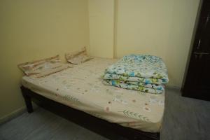 Postel nebo postele na pokoji v ubytování Om Trance Homestay