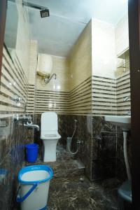 Koupelna v ubytování Om Trance Homestay + 21 fotografií