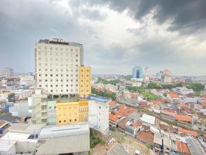 an overhead view of a city with buildings at Newly Renovated 3BR with Smart TV Braga City Walk Apartment By Travelio in Bandung