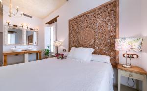Llit o llits en una habitació de Hotel Boutique Argantonio