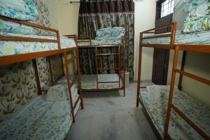 Postel nebo postele na pokoji v ubytování Om Trance Homestay
