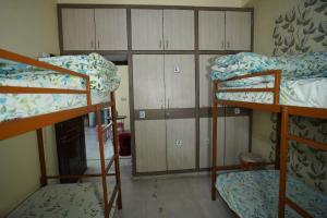 Postel nebo postele na pokoji v ubytování Om Trance Homestay