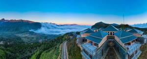 a building on top of a mountain with a view at Cloud Paradise Resort in Lao Cai +40 photos