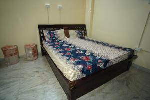 Postel nebo postele na pokoji v ubytování Om Trance Homestay