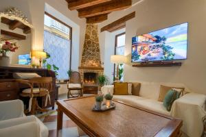 TV a/nebo společenská místnost v ubytování Hotel Argantonio