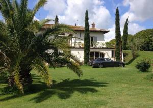 a car parked in front of a house at Villa Romana in Campagnano di Roma