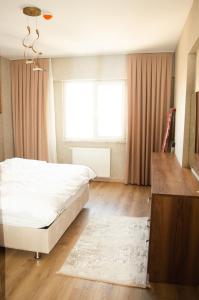 A bed or beds in a room at King Suite AN33
