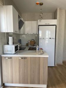 A kitchen or kitchenette at King Suite AN33