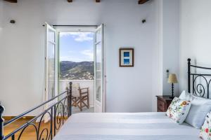 Ένα ή περισσότερα κρεβάτια σε δωμάτιο στο Villa Zoes