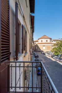a balcony with a railing next to a building at UNYCA - Domus22 - San Giovanni in Florence