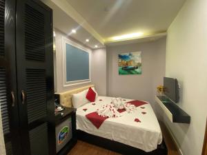 Voodi või voodid majutusasutuse Eclipse Legend Hotel toas