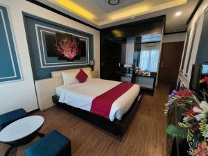Voodi või voodid majutusasutuse Eclipse Legend Hotel toas