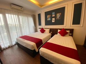 Voodi või voodid majutusasutuse Eclipse Legend Hotel toas