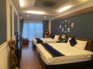 Voodi või voodid majutusasutuse Eclipse Legend Hotel toas