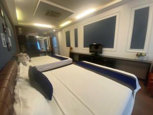 Voodi või voodid majutusasutuse Eclipse Legend Hotel toas