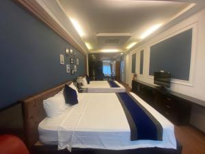 Voodi või voodid majutusasutuse Eclipse Legend Hotel toas