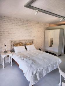 Ένα ή περισσότερα κρεβάτια σε δωμάτιο στο BestPlaceEver- Luxury Loft Apartment