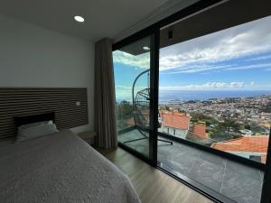 Ένα ή περισσότερα κρεβάτια σε δωμάτιο στο Bela Vista Funchal Villa