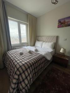 a bedroom with a bed with a large window at Classic Suite MS34 in Istanbul