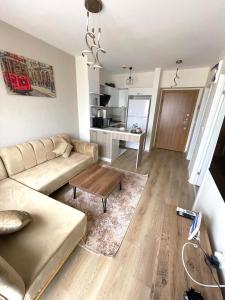 a living room with a couch and a table at Classic Suite MS34 in Istanbul