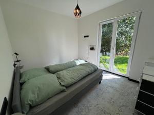 Ένα ή περισσότερα κρεβάτια σε δωμάτιο στο Ferienhaus Traumhafft