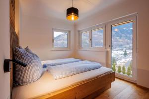 Posteľ alebo postele v izbe v ubytovaní Haus Silvretta NOVA