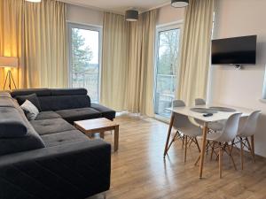 Χώρος καθιστικού στο Mazurski Sad apartament Juno