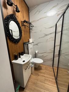 Ένα μπάνιο στο Mazurski Sad apartament Juno