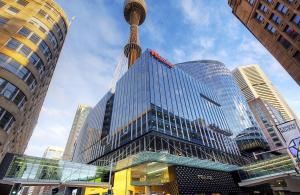 a tall building with a spire on top of it at Luxurious &cozy apartment with pool and gym in Sydney CBD in Sydney