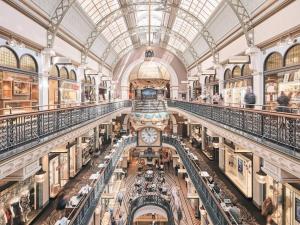 an overhead view of a shopping mall with a clock at Luxurious &cozy apartment with pool and gym in Sydney CBD in Sydney