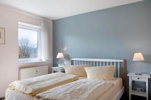 a bedroom with two beds and a window at Ferienwohnung Tannenblick 6-2 in Oberhof