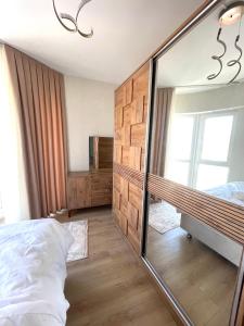 A bed or beds in a room at Two Bedroom King Suite BH46