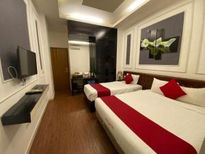 TV a/nebo společenská místnost v ubytování Eclipse Legend Hotel