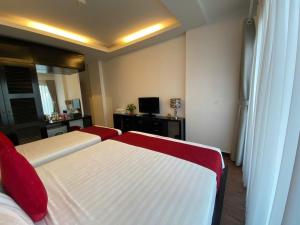 Voodi või voodid majutusasutuse Eclipse Legend Hotel toas