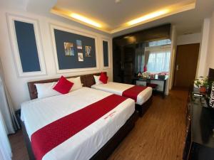 Voodi või voodid majutusasutuse Eclipse Legend Hotel toas